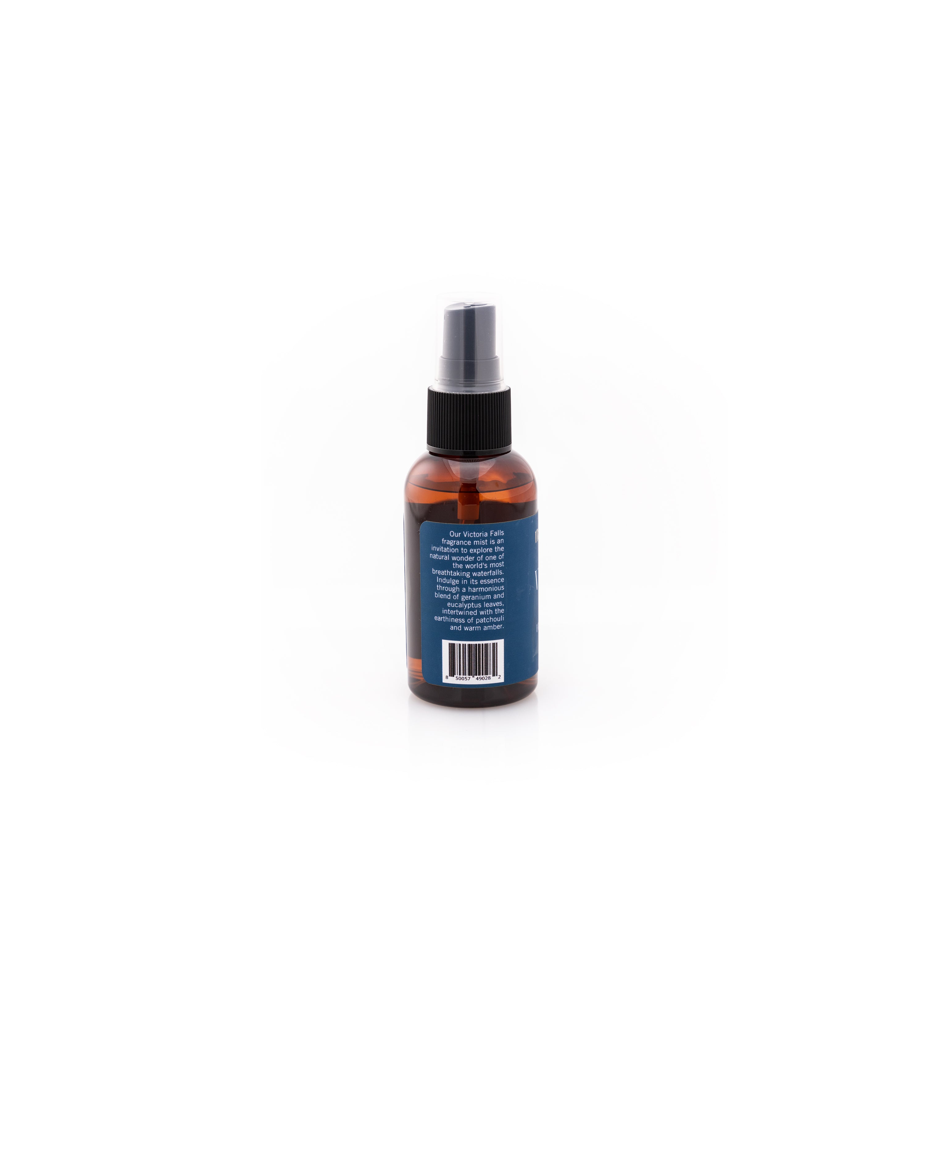 Victoria Falls Fragrance Mist Bottle Description, which reads: Our Victoria Falls fragrance mist is an invitation to explore the natural wonder of one of the world's most breathtaking waterfalls. Indulge in its essence through a harmonious blend of geranium and eucalyptus leaves, intertwined with the earthiness of patchouli and warm amber.